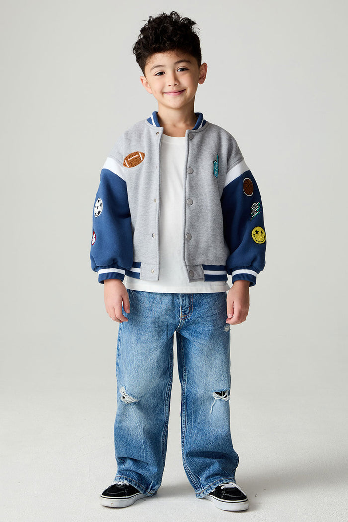 A full body front view of a boy wearing the Chaser Team Spirit Boys Jacket on a neutral background