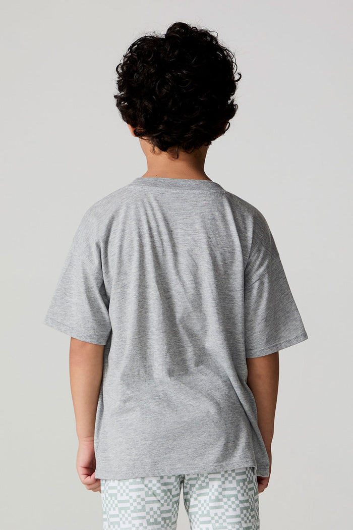Back view of a boy wearing the Chaser Tennis Club Tee on a neutral background