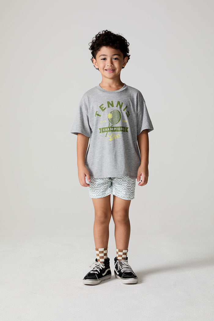Full body front view of a boy wearing the Chaser Tennis Club Tee on a neutral background