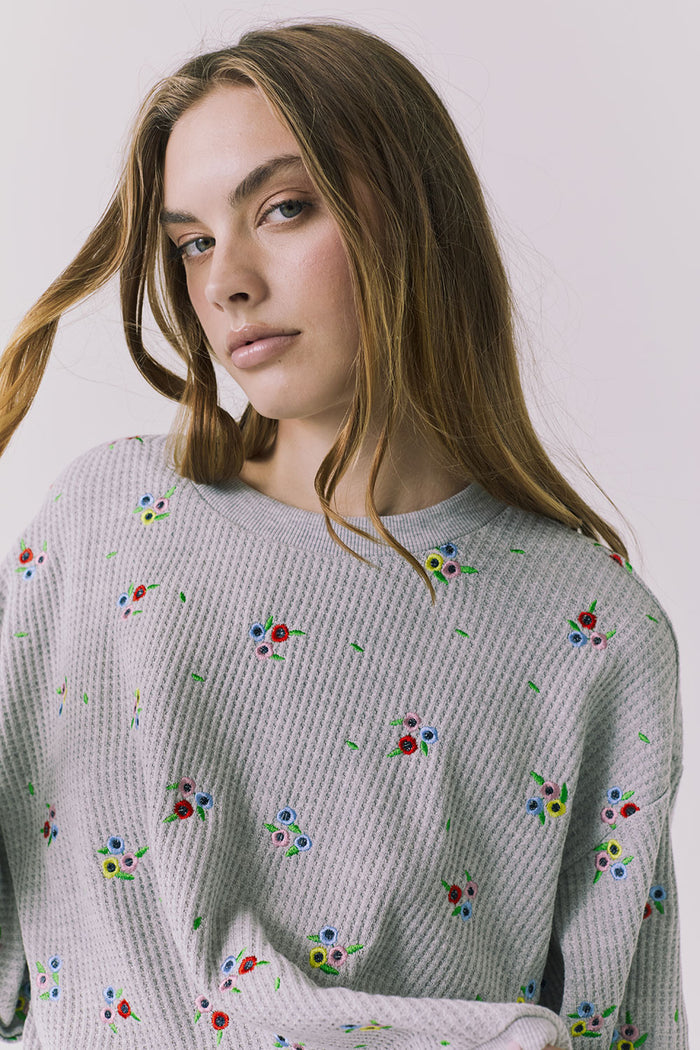 Chaser Terra Heather Grey Ditsy Embroidery Pullover close up showcasing multicolor ditsy floral embroidery on textured knit