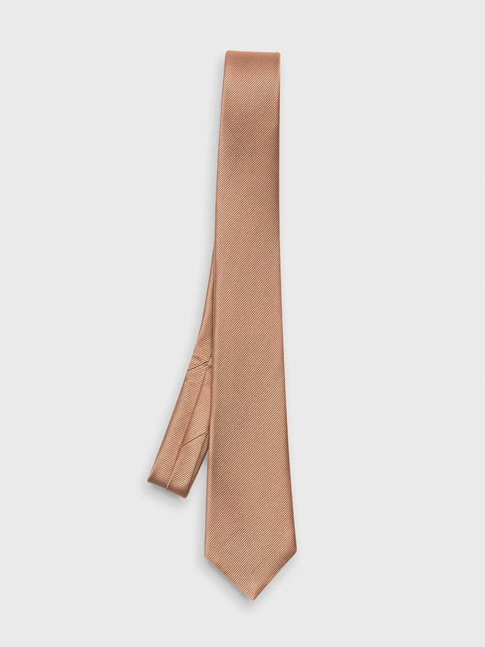 Terracotta silk necktie draped with a diagonal weave on a white background