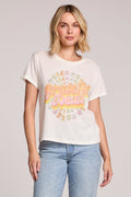 Front view of a woman wearing the Chaser Grateful Dead Dancing Bears Tee and jeans on a neutral background