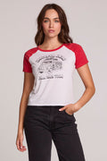 Front view of a woman wearing the The Grateful Dead Fall 1989 Tour Tee on a neutral background with hand in one pocket
