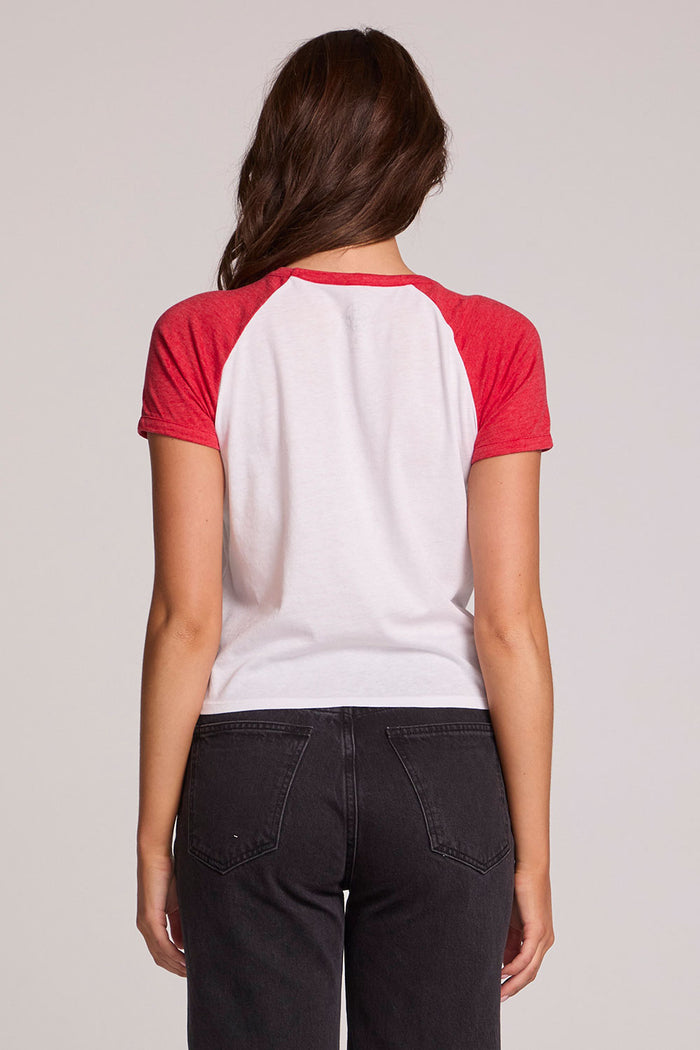 Back view of a woman wearing the The Grateful Dead Fall 1989 Tour Tee on a neutral background with arms lowered