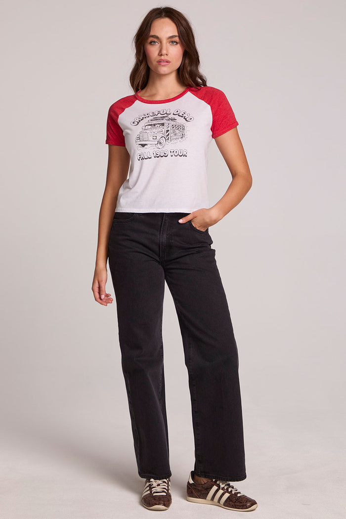 A full body front view of a woman wearing the The Grateful Dead Fall 1989 Tour Tee on a neutral background