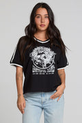 Front view of a woman wearing the Chaser The Grateful Dead Winterland Area Tee on a neutral background with hand on hip