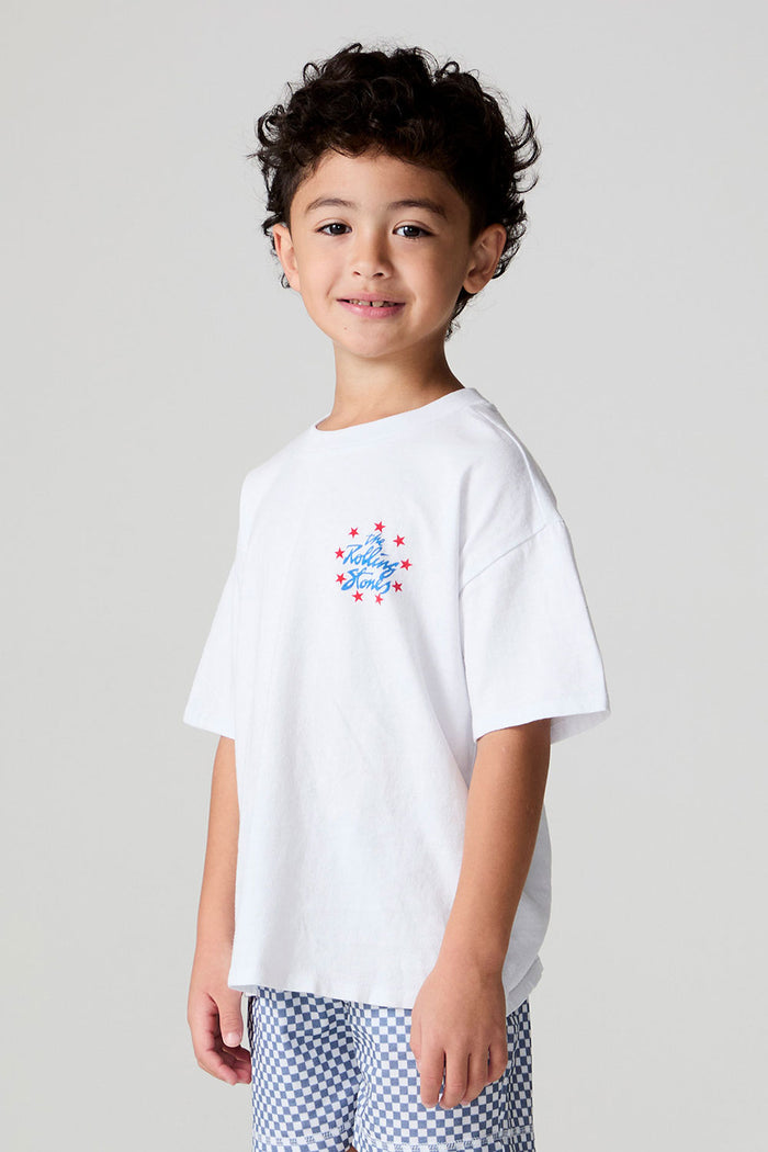 Side angle view of a boy wearing the Chaser  The Rolling Stones Stars Tee on a neutral background