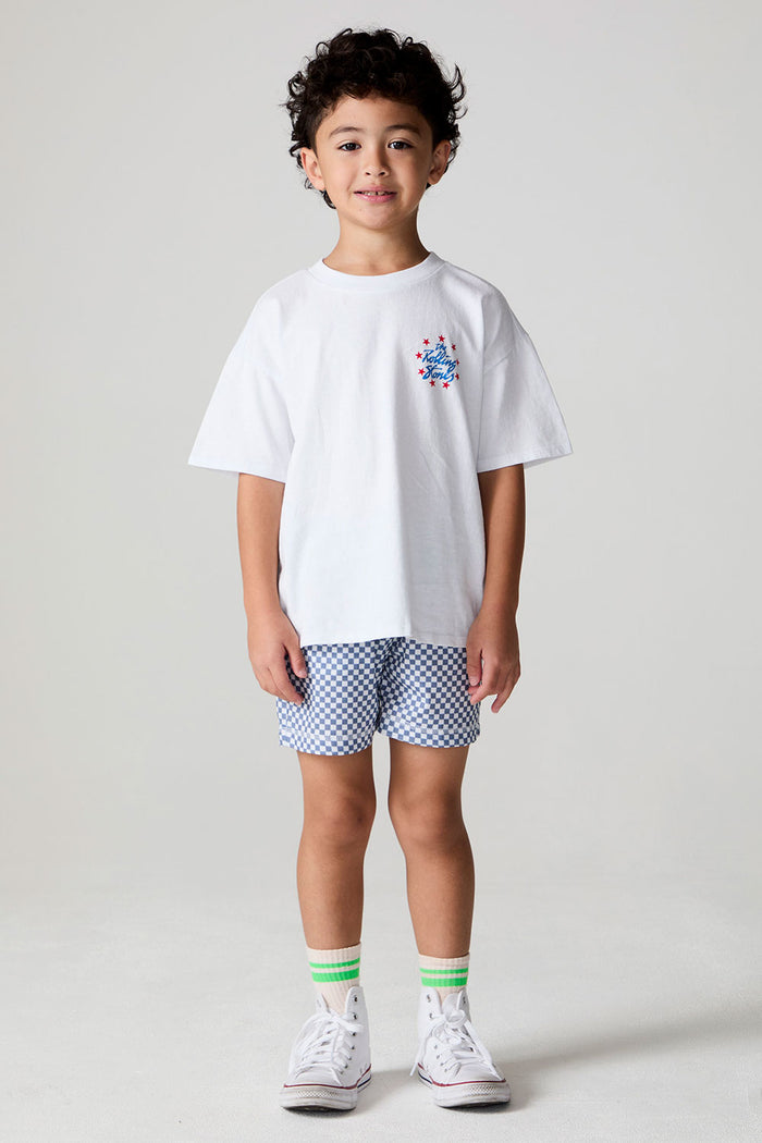 Full body front view of a boy wearing the Chaser  The Rolling Stones Stars Tee on a neutral background