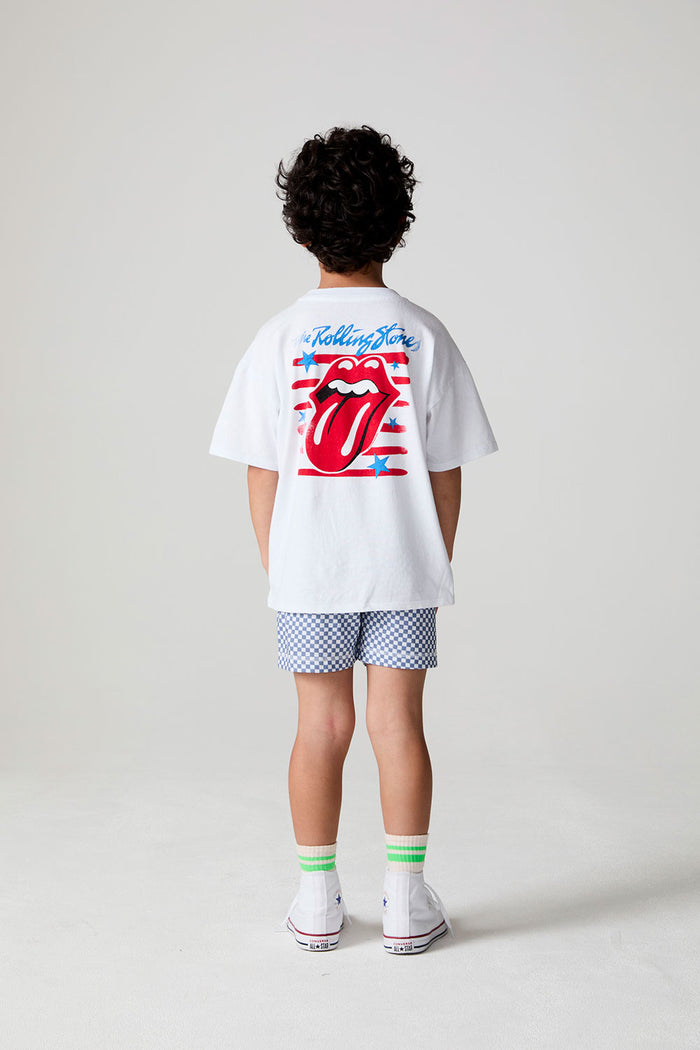 Full body back view of a boy wearing the Chaser  The Rolling Stones Stars Tee on a neutral background