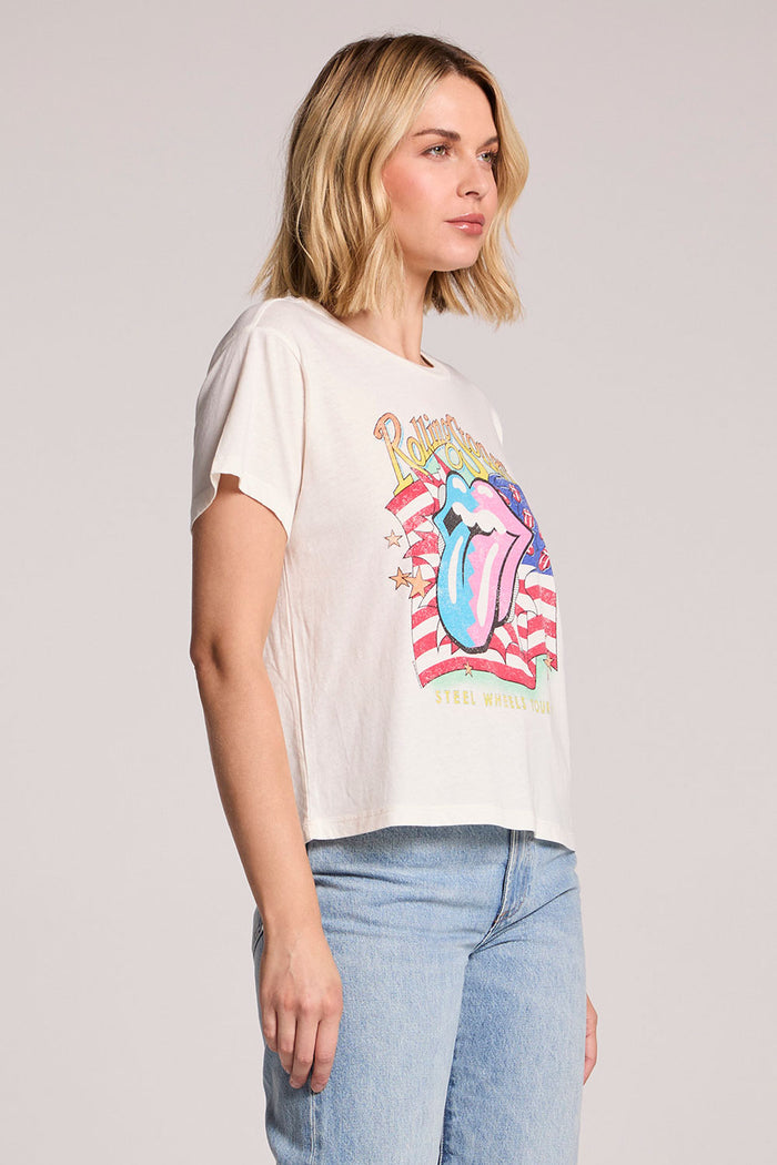 Side angle view of a woman wearing the Chaser The Rolling Stones USA Tour 89 Tee on a neutral background