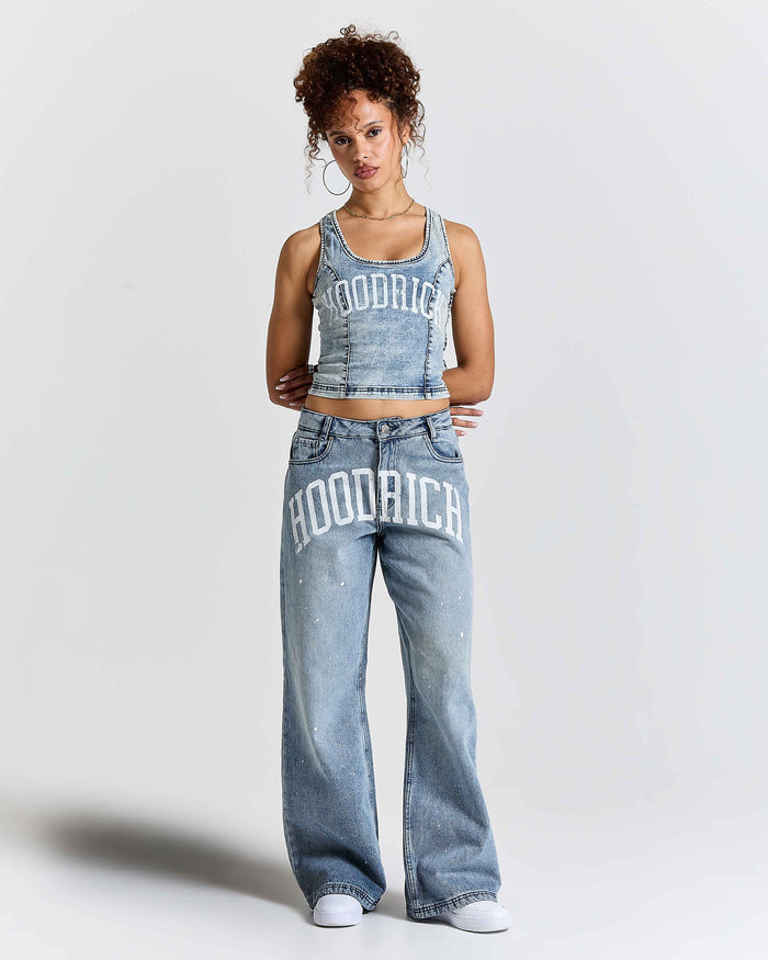 Woman wearing a matching denim outfit with 'Hoodrich' branding on a white background