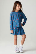 Full body front view of a girl wearing the Chaser Tiny Hearts Girls Skirt on a neutral background with matching shirt