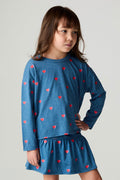 Front view of a girl wearing the Chaser Tiny Hearts Girls Tee on a neutral background with arms at sides