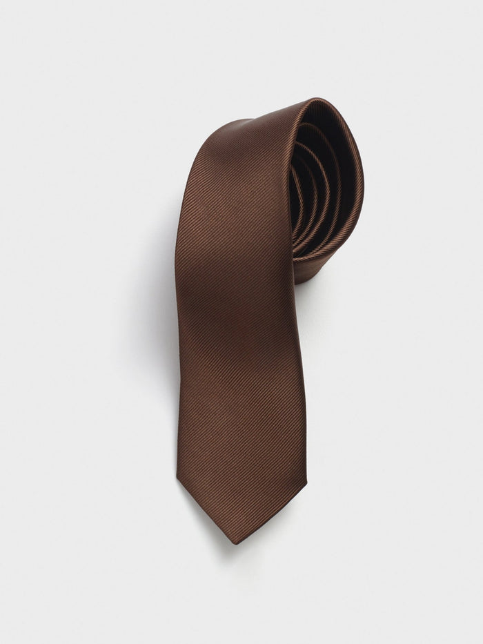 Tobacco silk tie, rolled, on light grey background