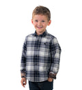 Toddler Cubs Flannel Shirt in Butte Blue, a blue and white plaid with rolled cuffs, worn with dark jeans by a young boy.