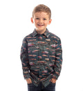 Smiling boy in Pladra's Toddler Cubs Printed Shirt-Trout, featuring a colorful fish pattern on cotton.