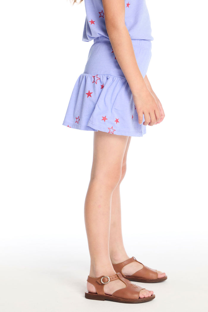 Side view of the Chaser Kids Tossed Stars Powder Blue Peplum Skort showing the flouncy silhouette and elastic waistband