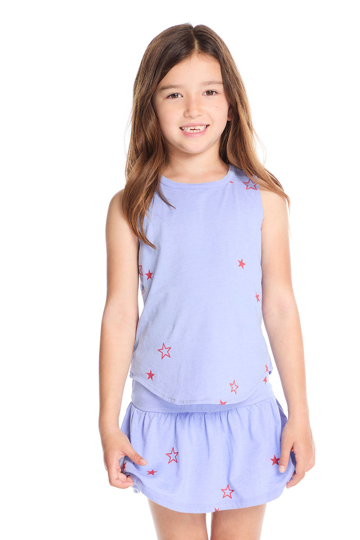 Girl wearing the Chaser Kids Tossed Stars Powder Blue Tank featuring scattered red star prints on a soft light blue sleeveless top