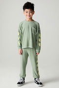 Full body front view of a boy wearing the Chaser Touchdown Pants Boys Jogger on a neutral background and matching long-sleeve shirt