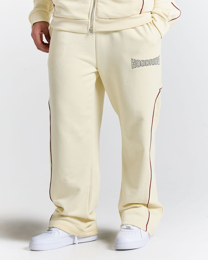 Beige sweatpants with a brand logo on a white background