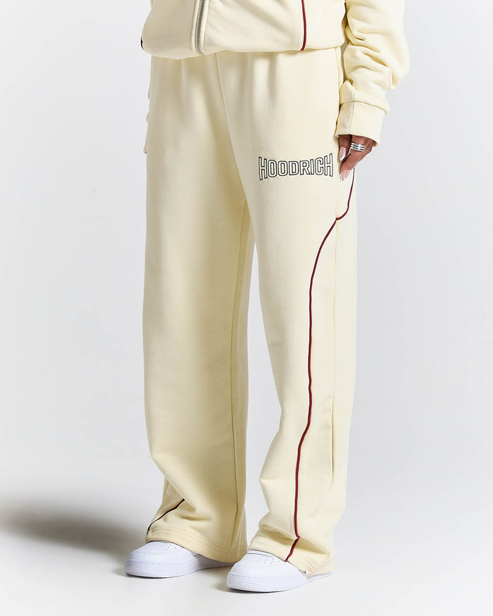 Cream-colored tracksuit with 'Hoodrich' branding on a white background