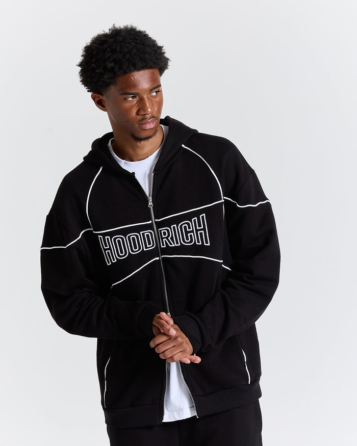 Person wearing a black 'HOODRICH' jacket on a white background