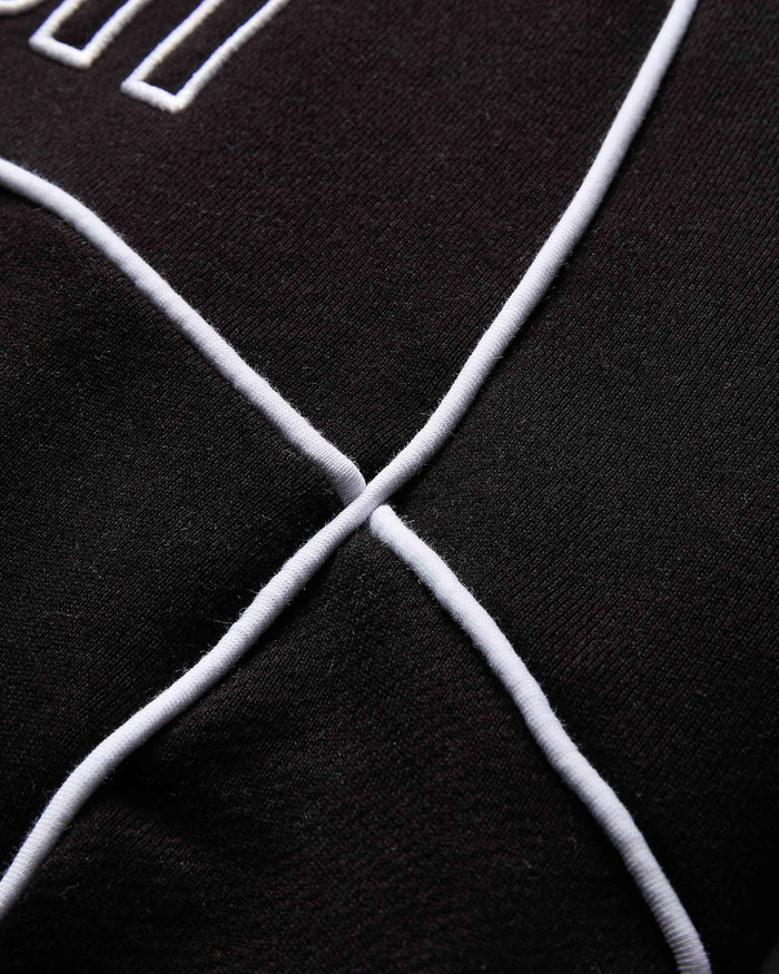 Close-up of a black surface with white geometric lines