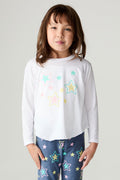 Front view of a girl wearing the Chaser Under The Stars Girls Tee on a neutral background with star pants