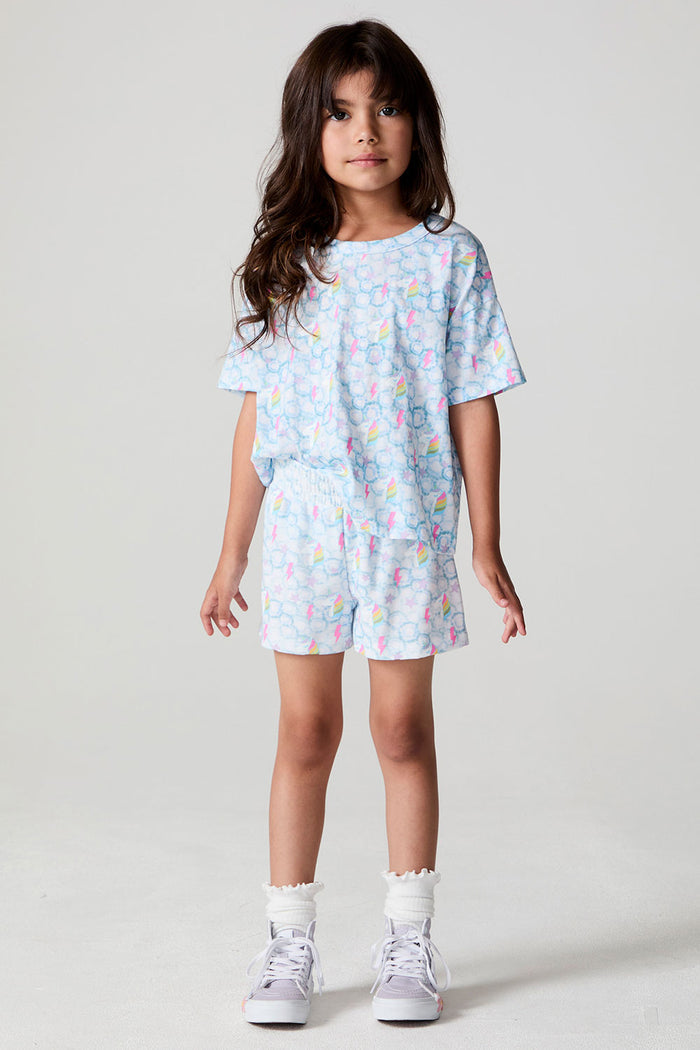 Full body front view of a girl wearing the Chaser  Unicorn Lightning Skort on a neutral background