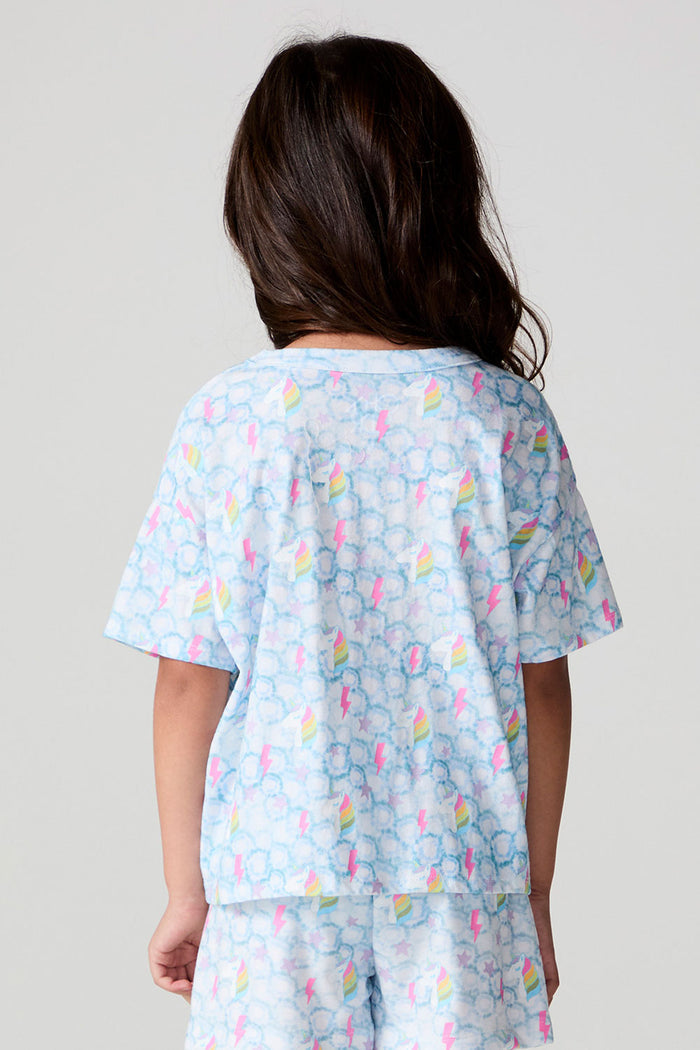 Back view of a girl wearing the Chaser Unicorn Lightning Tee on a neutral background