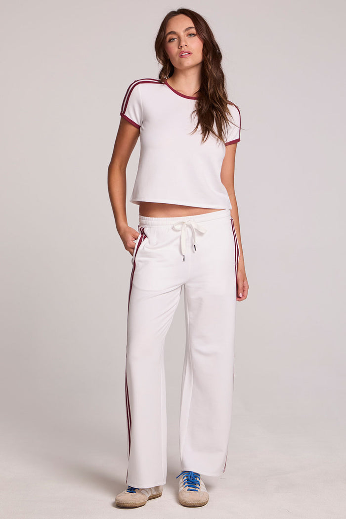 A full body front view of a woman wearing the Chaser Urban Cloud White Tee on a neutral background