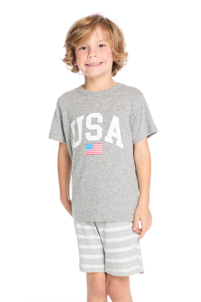 Boy wearing the Chaser Kids gray USA Crew Neck Tee with an American flag on a white background