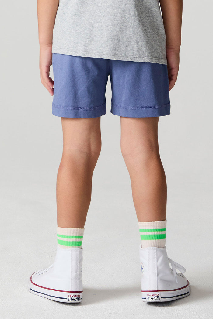 Back view of a boy wearing the Chaser U.S.A. Flag Shorts on a neutral background
