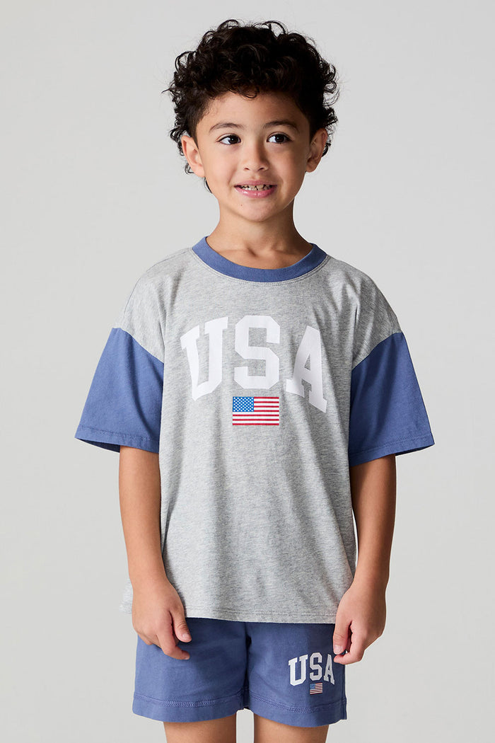 Front view of a boy wearing the Chaser U.S.A. Flag Tee on a neutral background