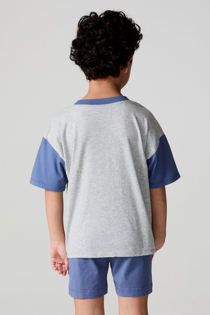 Back view of a boy wearing the Chaser U.S.A. Flag Tee on a neutral background