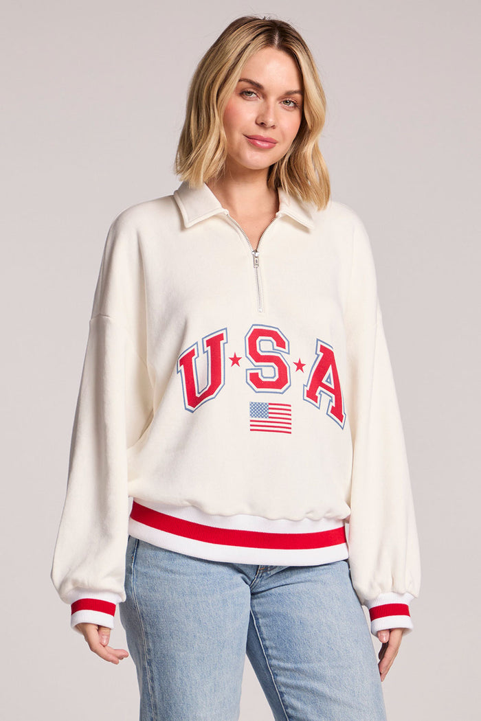 Front view of a woman wearing the Chaser USA Pullover on a neutral background