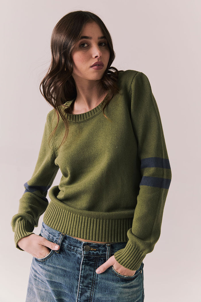 Front view of Varsity Star Sweater in bronze green with slouchy fit and twin arm stripes against a plain background