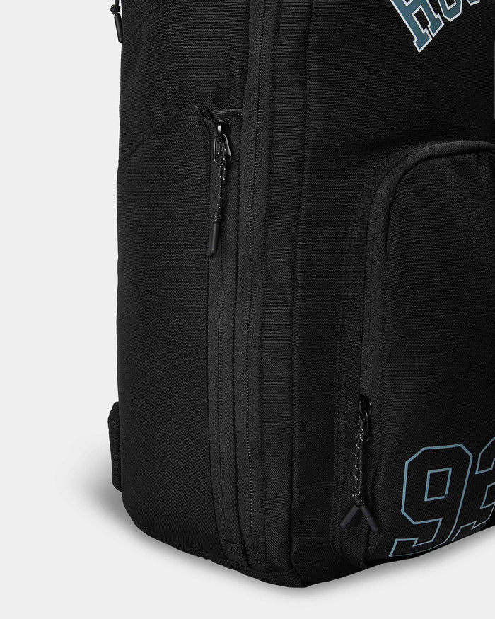 Black backpack with visible branding on a light gray background