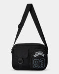 Black shoulder bag with 'Property of Hoobrick 93' text on a white background