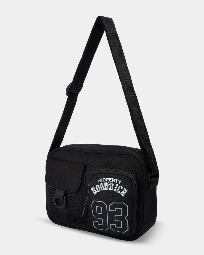 Black shoulder bag with text on a light gray background