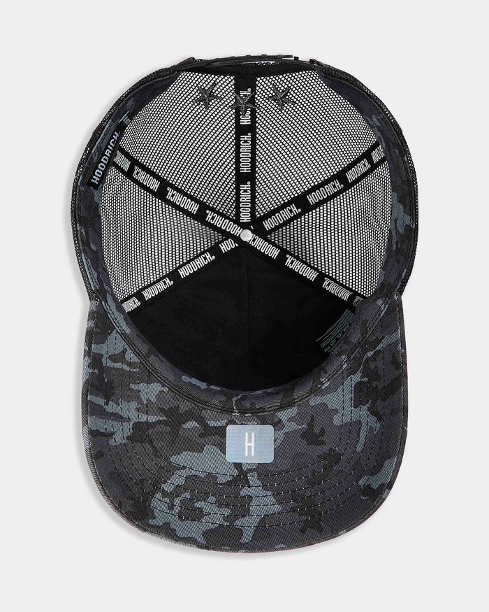 Black and gray camouflage baseball cap with mesh back on a light gray background