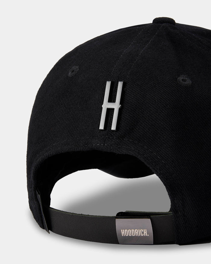 Black cap with a logo and 'HOODRICH' label on a light gray background