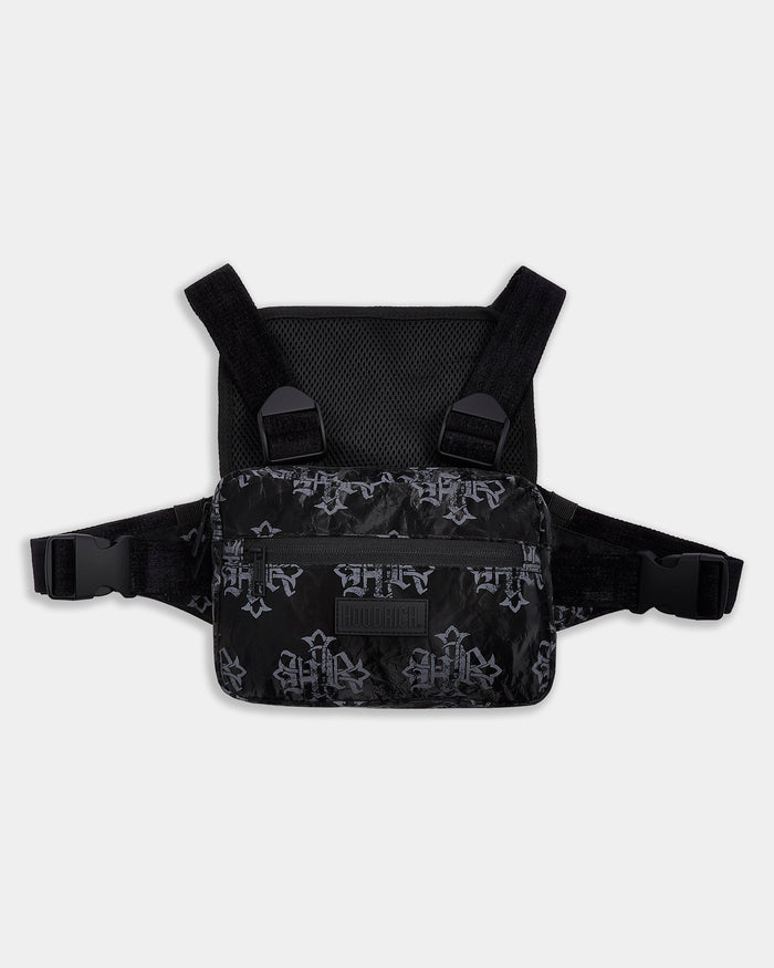 Black chest harness with cross patterns on a light gray background