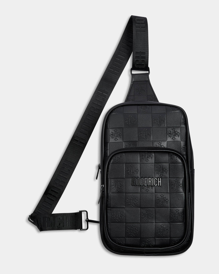 Black checkered sling bag with visible brand logo on a light gray background
