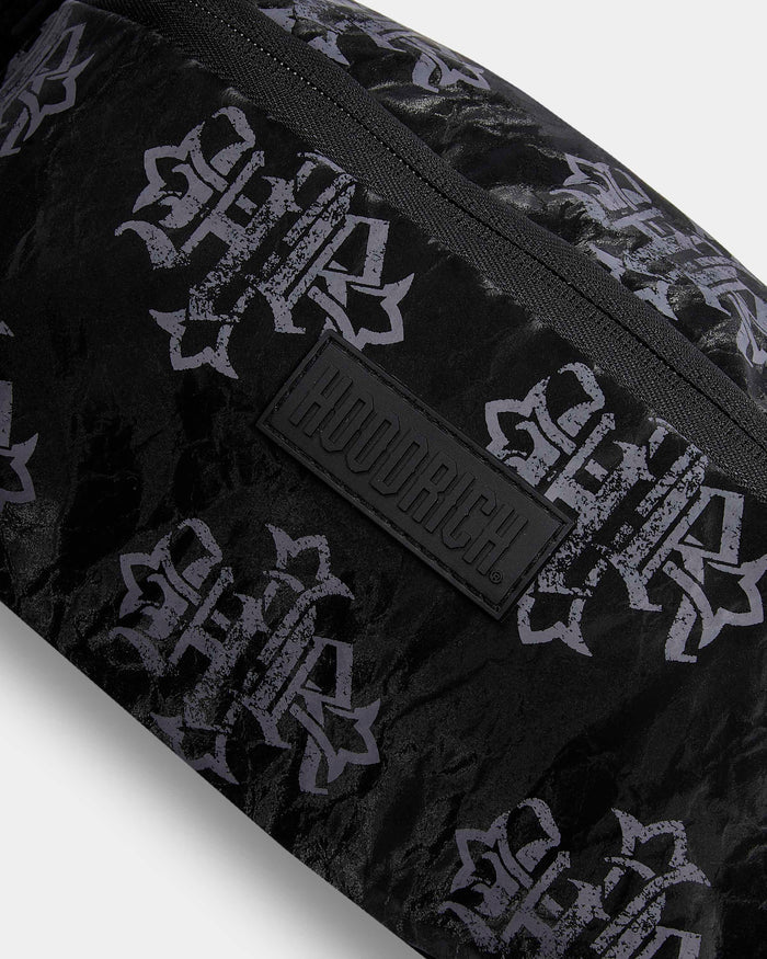 Black bag with white pattern and visible brand logo on a light gray background
