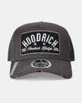 Black trucker cap with 'Hoodrich' branding on a white background