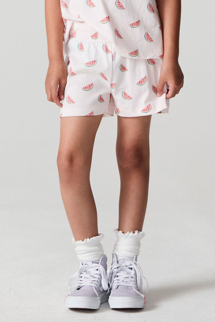 Front view of a girl wearing the Chaser Watermelon All Over Shorts  on a neutral background
