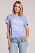 Front view of a woman wearing the Chaser  Weekend State Of Mind Tee and jeans on a neutral background