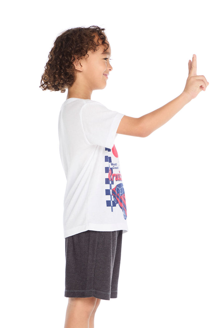 Side view of Chaser Kids West Coast Cruisin Tee showing soft knit fabric and short sleeve silhouette with bold retro print