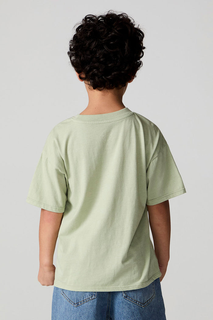 Back view of a boy wearing the Chaser Western Time Tee on a neutral background